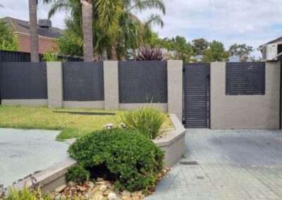 front fence with concrete and aluminium slats
